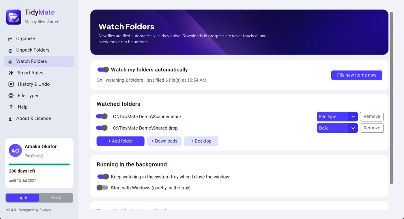 Watch Folders page showing the Downloads folder being watched and files filed automatically